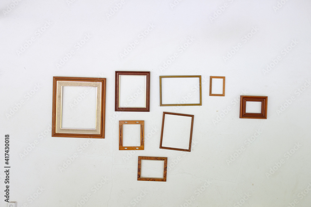 empty picture frames on white wall empty picture frames on white wall