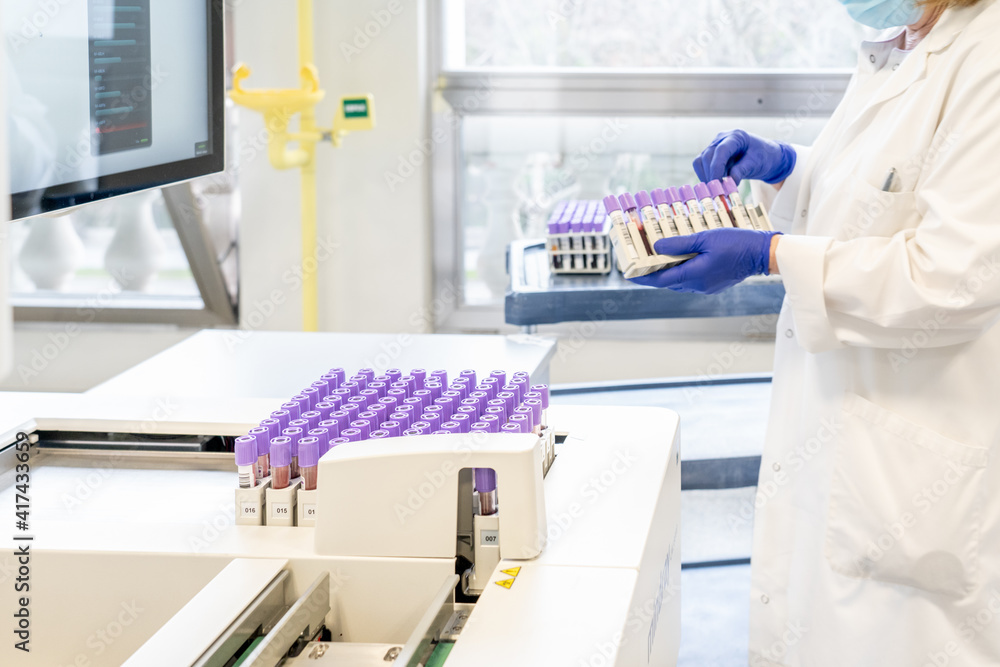 woman in laboratory doing tests for vaccine blood extraction and analytical woman in laboratory doing tests for vaccine blood extraction and analytical