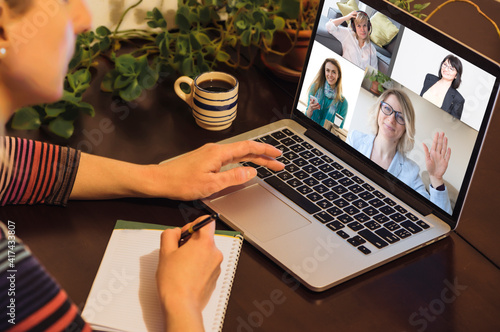 Business woman working from home, has online videoconference on laptop on laptop
