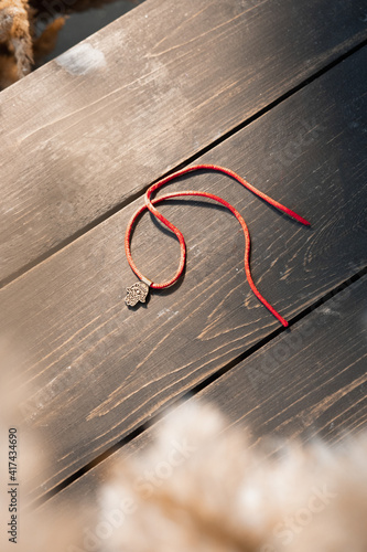 Red ribbon with love on hand, bracelet