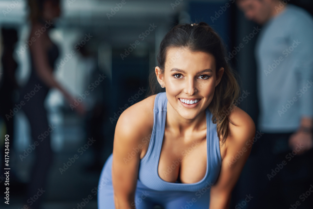 Adult woman working out in a gym Adult woman working out in a gym