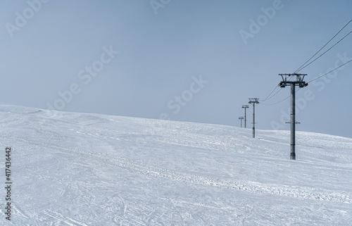 Resorts of the North Caucasus. The northern slope of the Arkhyz ski resort. Ski lift. White and blue winter landscape. 