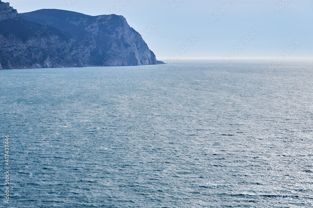view of the winter sea with a high cliff view of the winter sea with a high cliff