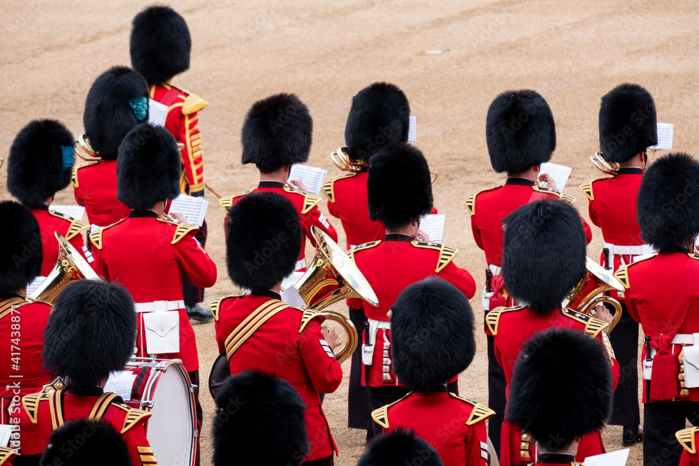 Fototapeta Trooping the Colour, military ceremony at Horse Guards Parade, Westminster. Coldstream Guards in the band, in red and black traditional uniform and bearskin hats.