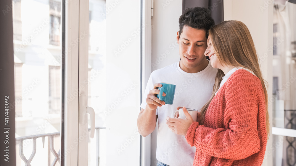Portrait of young couple relaxing and enjoying time together while having coffee Portrait of young couple relaxing and enjoying time together while having coffee