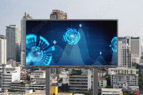 Technology hologram on billboard over panorama city view of Bangkok. The largest tech hub in Southeast Asia. The concept of developing coding and high-tech science.