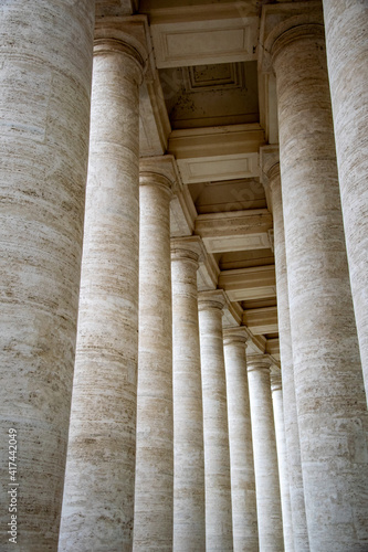 the beautiful walkway of stone pillars surrounding the Vatican building in Rome, Italy