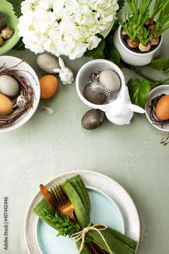 Photography Easter table setting with traditional Easter home decor and tableware