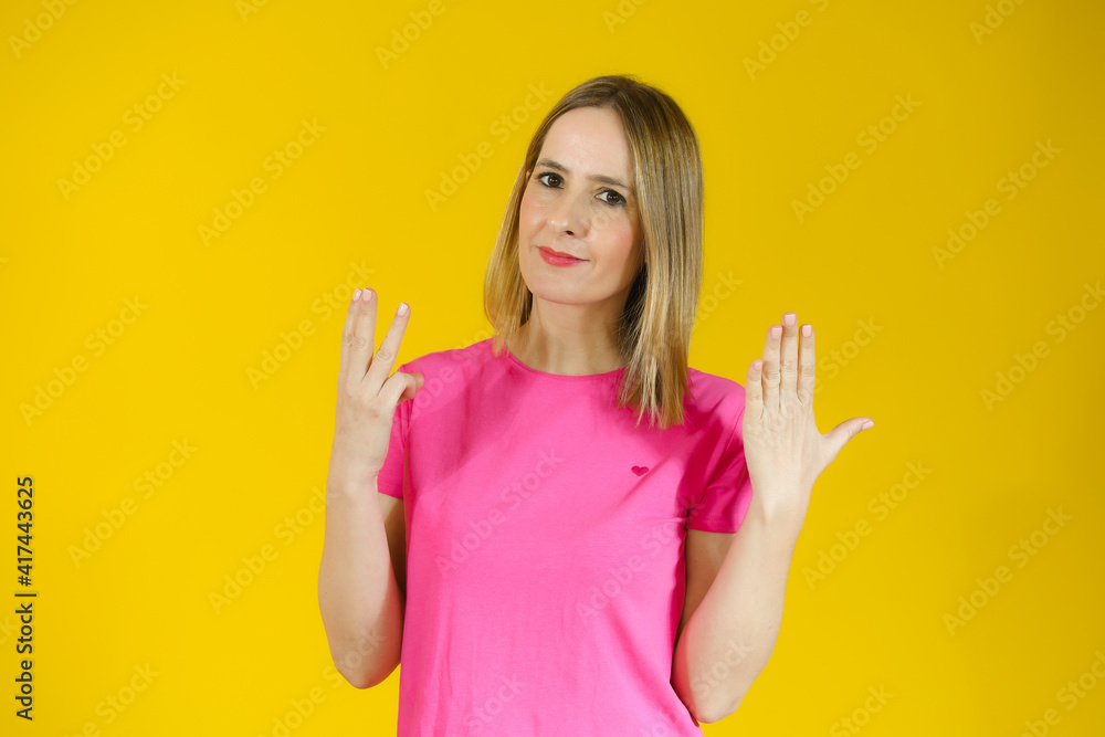 Young smiling woman over isolated yellow background counting eight with fingers Young smiling woman over isolated yellow background counting eight with fingers