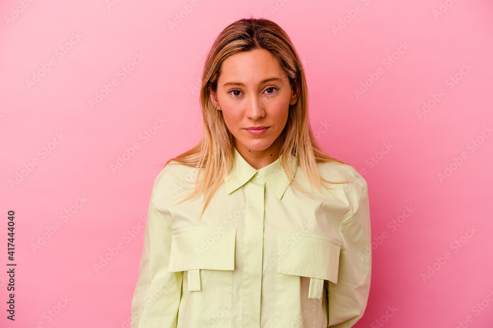 Young mixed race woman isolated on pink background sad, serious face, feeling miserable and displeased. Young mixed race woman isolated on pink background sad, serious face, feeling miserable and displeased.