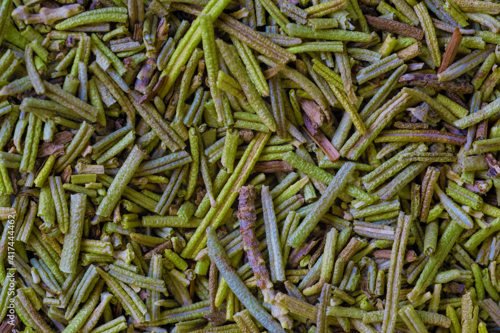 pile of dry rosemary needles. Dried crushed rosemary leaves top view close up. Ground seasoning, herbs and spices pile of dry rosemary needles. Dried crushed rosemary leaves top view close up. Ground seasoning, herbs and spices