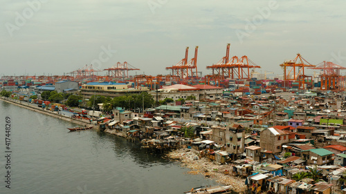 Aerial view of container terminal in the city of Manila. Largest cargo port. modern harbor and global trade background ,Philippines.