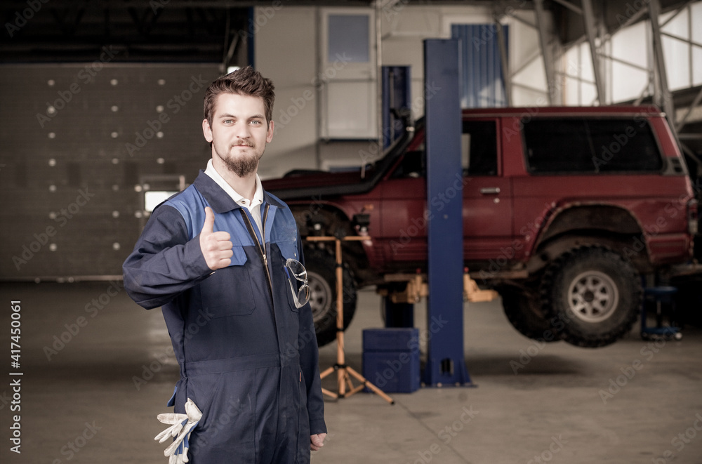 car mechanic at work in a garage car mechanic at work in a garage