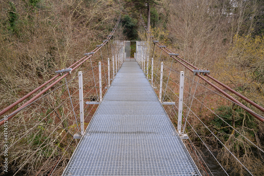 Modern suspension bridge over the Ulla river in the Area do Xirimbao, Teo, Galicia, Spain.