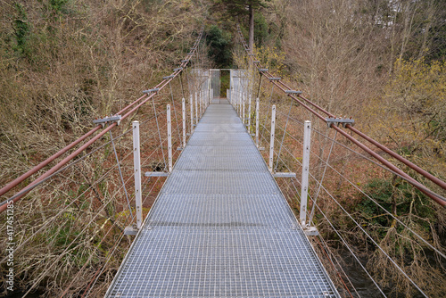 Modern suspension bridge over the Ulla river in the Area do Xirimbao  Teo  Galicia  Spain.