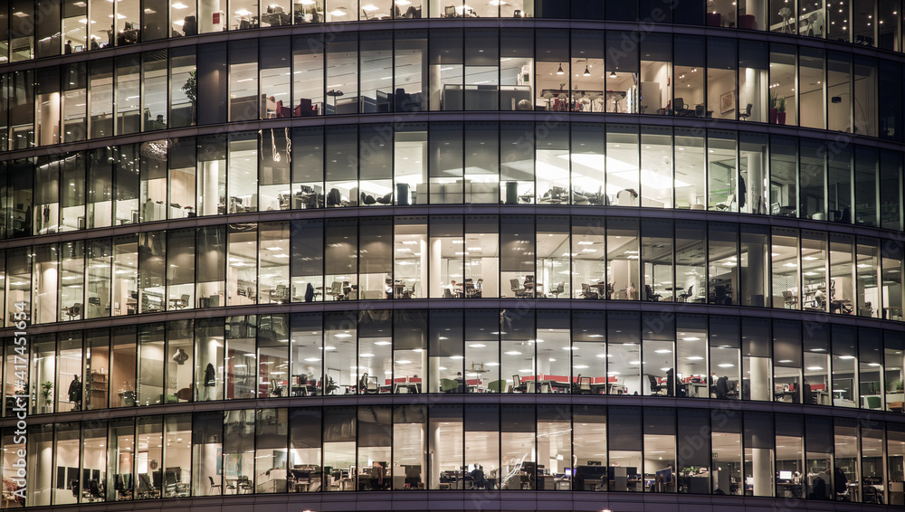 business office windows at night  Corporate building London City  England