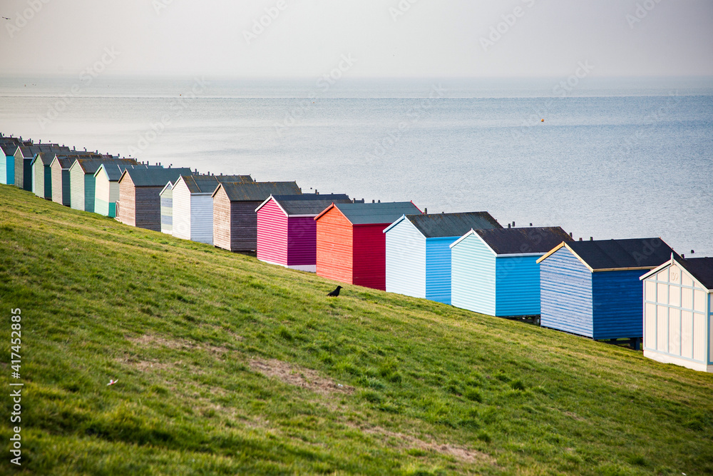 row of beach huts in Tankerton near Whitstable in Kent - British summer