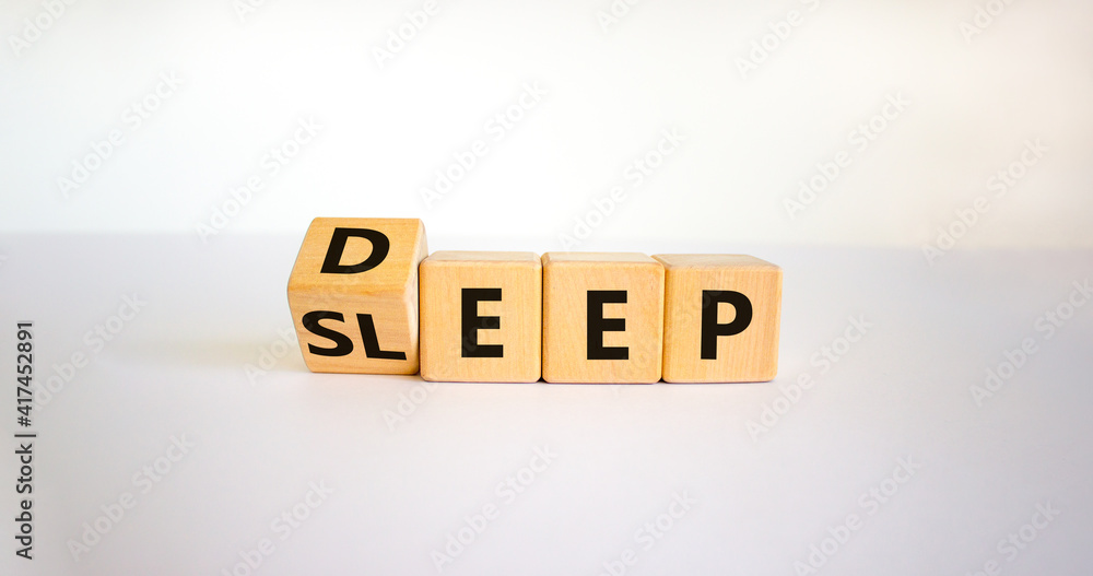 Sleep deep symbol. Turned a wooden cube with words sleep deep. Beautiful white background, copy space. Healthy lifestyle, medical and sleep deep concept. Sleep deep symbol. Turned a wooden cube with words sleep deep. Beautiful white background, copy space. Healthy lifestyle, medical and sleep deep concept.