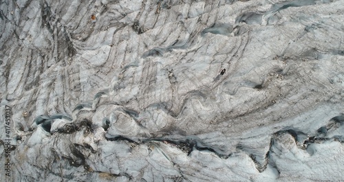 The Marmolada glacier in summer: Aerial view of the last and the only glacier of the Dolomites, UNESCO heritage, near the town of Canazei - August 2018 - Evidence of global warming and melting glacier