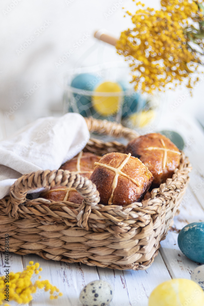 Hot cross buns served in wicker tray Hot cross buns served in wicker tray