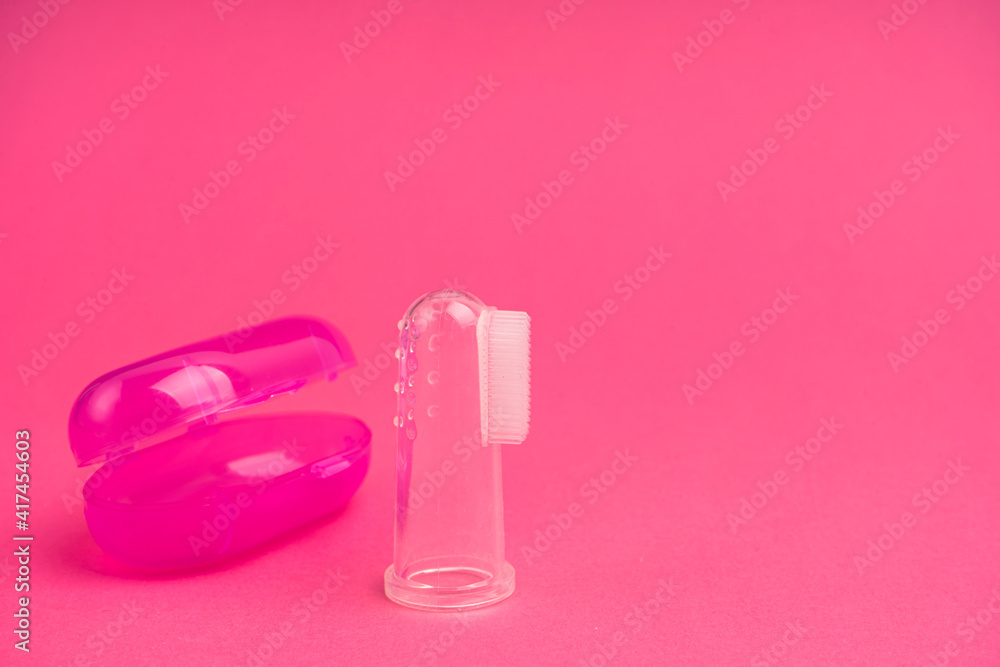Compact toothbrush fingertip. Travel hygiene close up Compact toothbrush fingertip. Travel hygiene close up