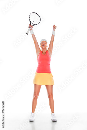 Tennis player with racket in blue costume. Woman athlete playing isolated on white background. © Mike Orlov