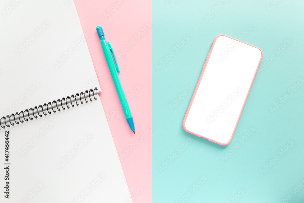 mobile phone with notebook on workspace. Office background mobile phone with notebook on workspace. Office background