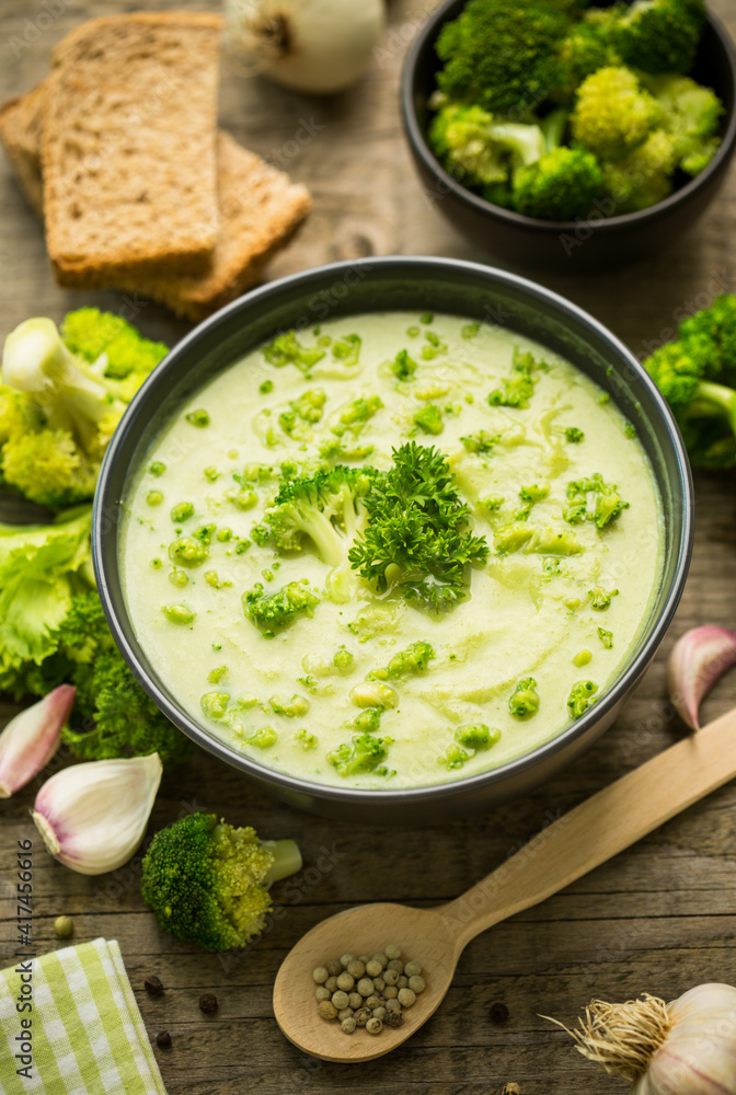 Fresh broccoli soup on the wooden table
Fresh broccoli soup on the wooden table