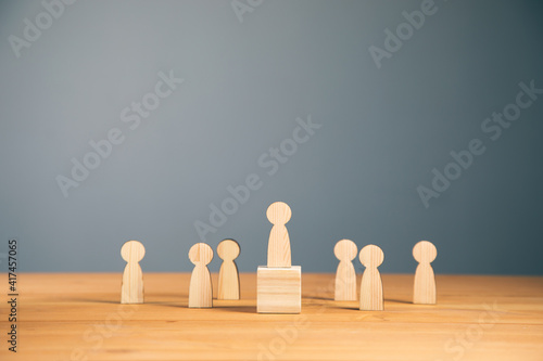 Teamwork and organization with wooden figures