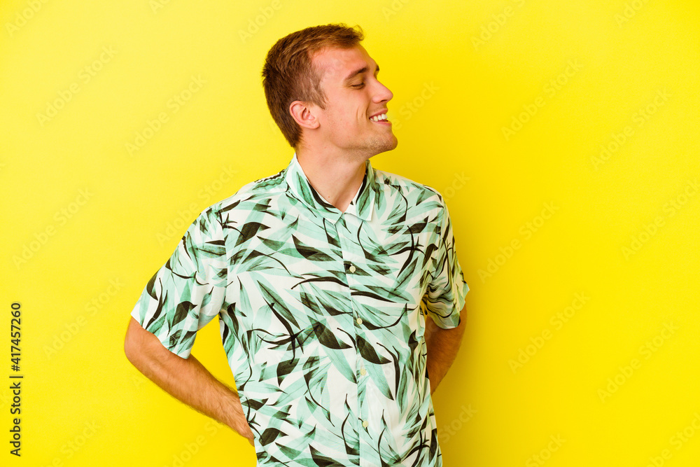 Young caucasian man isolated on yellow background Young caucasian man isolated on yellow background