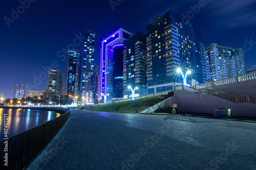Night City shot with buildings and a bridge 
