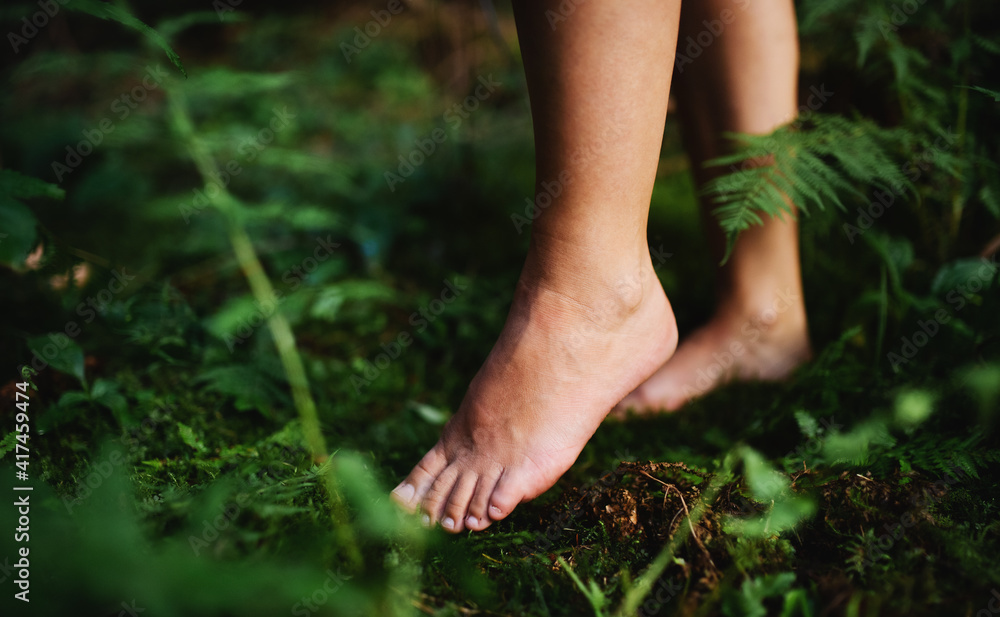 Bare feet of woman standing barefoot outdoors in nature, grounding concept.  Stock Photo | Adobe Stock