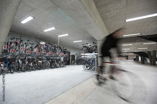 Motion blurred people - figures in an underpassage getting to their workplace in the morning. Busy city business life. photo