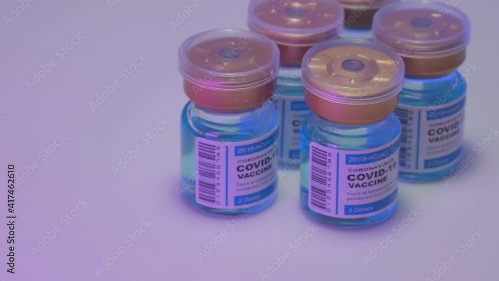 B-roll cinematic panning macro shot of covide-19 coronavirus vaccine concept in a bottle. B-roll cinematic panning macro shot of covide-19 coronavirus vaccine concept in a bottle.