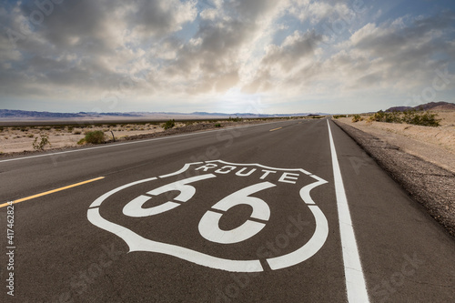 Route 66 highway sign with dawn sky near Amboy in the California Mojave desert. 