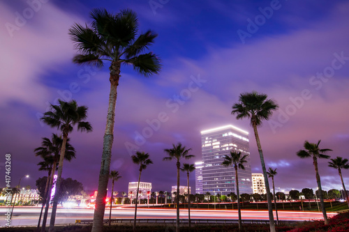 Twilight evening view of traffic streaming by the downtown skyline of Irvine, California, USA. © Matt Gush