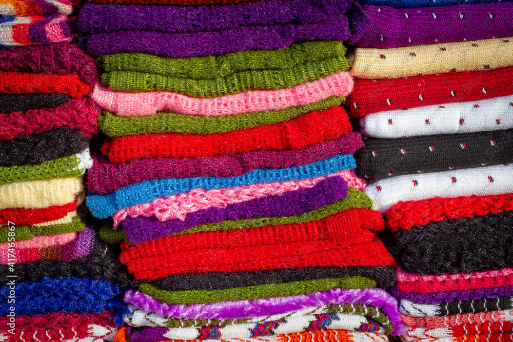 A pile of colorful scarves