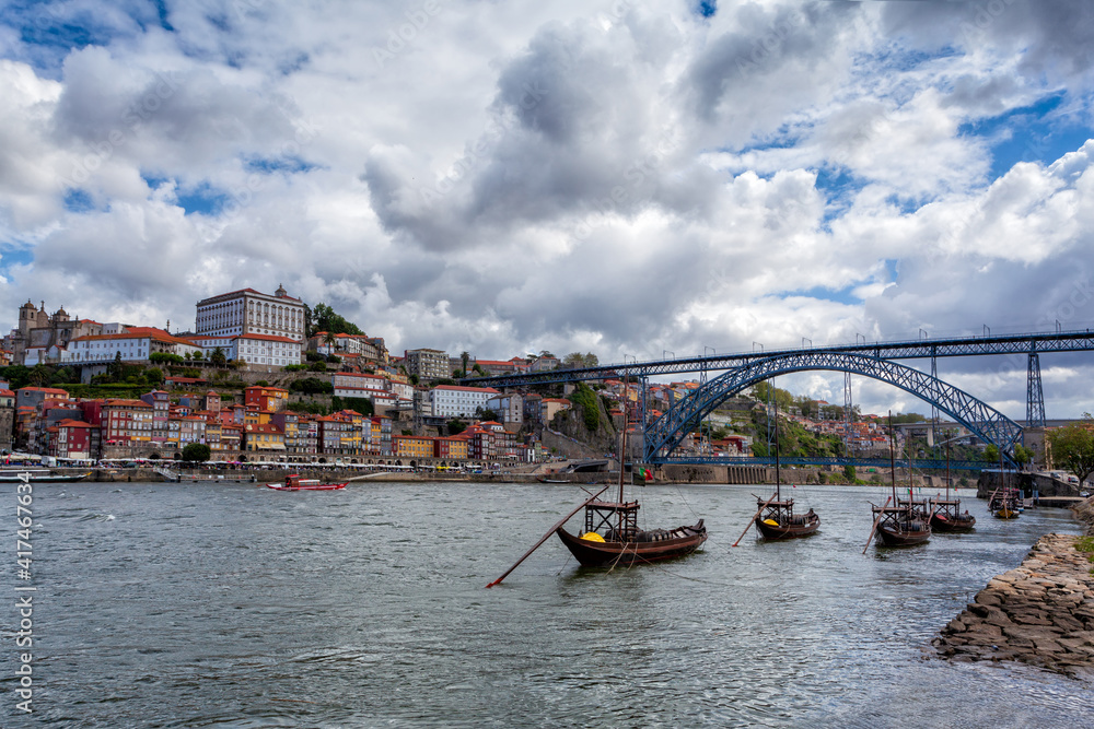 Obraz premium Oporto, Portugal, Europe. Postcard from the picturesque city of Porto, amazing travel destination in Portugal. View to the historic center, Douro River with its beautiful bridge and old monuments.