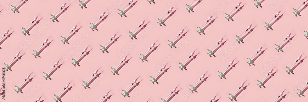 Syringe drug. Doctor injection vaccine pattern. Hard shadow. Healthcare therapy. Cosmetology treatment. Age skin rejuvenation. Beauty science laboratory. Virus concept. Pink background. Repeat many Syringe drug. Doctor injection vaccine pattern. Hard shadow. Healthcare therapy. Cosmetology treatment. Age skin rejuvenation. Beauty science laboratory. Virus concept. Pink background. Repeat many