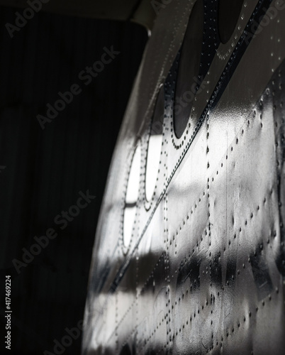 Canvas Print Part of the aluminum fuselage of the aircraft with rivets and portholes