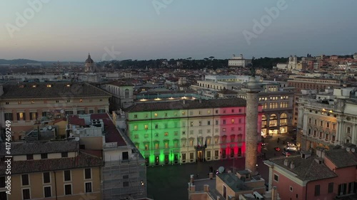 Palazzo Chigi in Rome seat of the Italian government. The tricolor of the Italian flag illuminates the facade photo