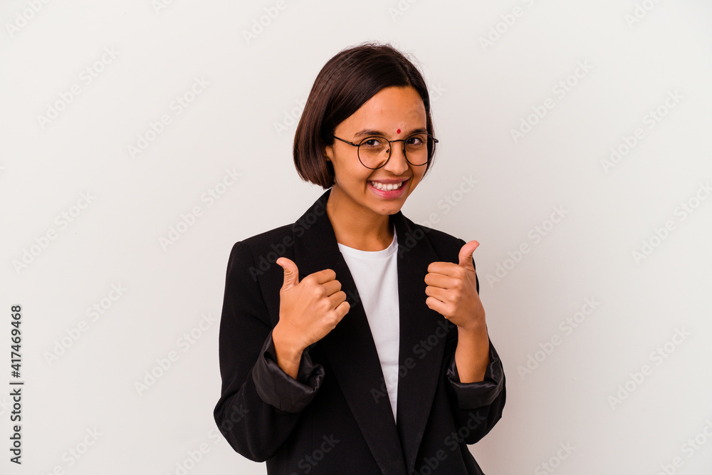 Young business Indian woman isolated on white background raising both thumbs up, smiling and confident. Young business Indian woman isolated on white background raising both thumbs up, smiling and confident.