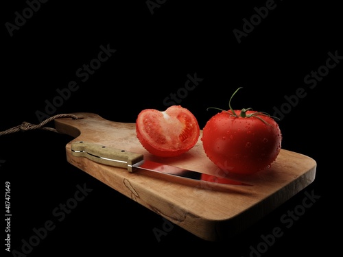 tomato on board and knife