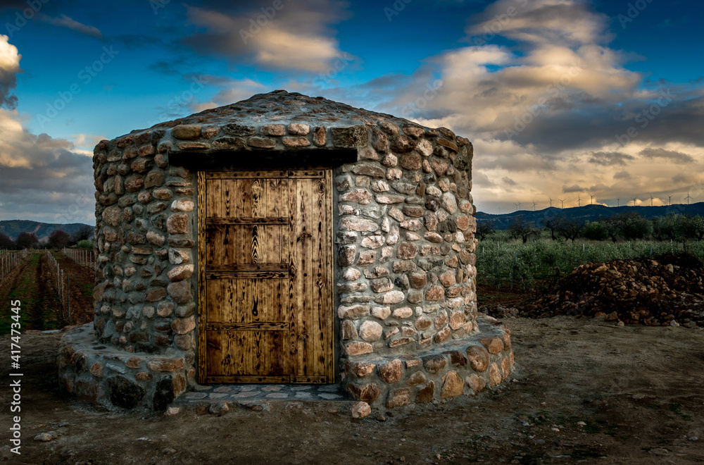building in the vineyards of La Rioja at sunset