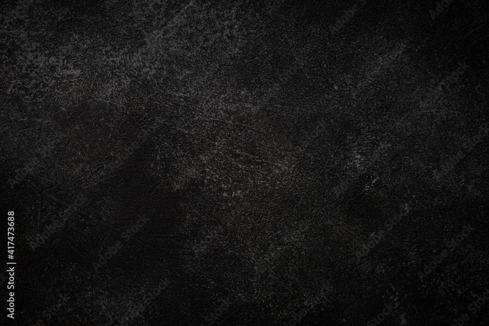 Black background. Black stone or concrete background. Free space for your design. Black background. Black stone or concrete background. Free space for your design.