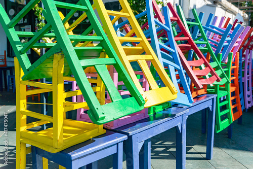 Colored chairs composed in non-working period, a street outdoor cafe in the Turkish city of Kas