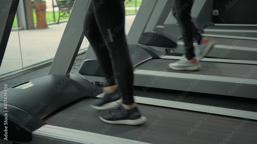 Fitness concept of 4k Resolution. close up feet are running on a treadmill. Fitness concept of 4k Resolution. close up feet are running on a treadmill.