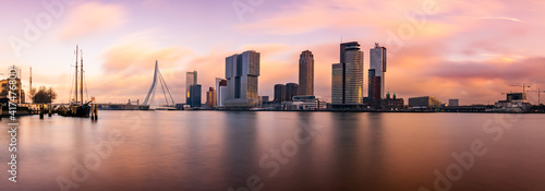 Long exposure panoramic view on the skyline of Rotterdam during sunset. photo