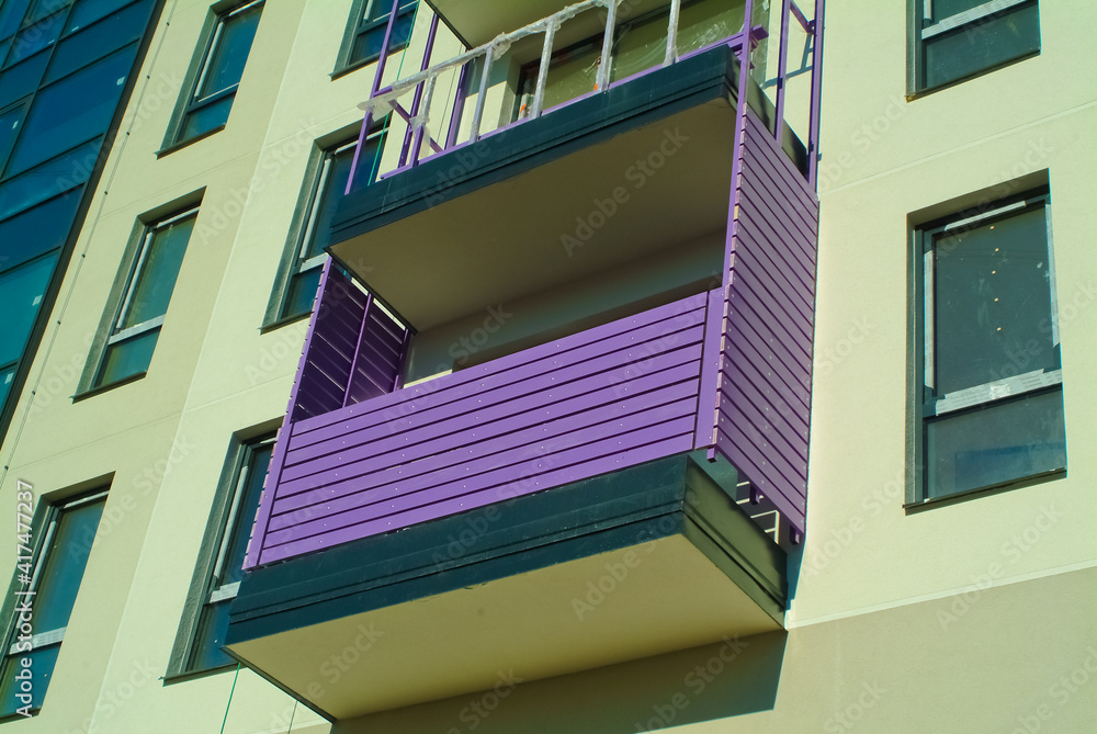 Fototapeta premium RIGA, LATVIA-January 27, 2021: modern apartment building with purple balconies