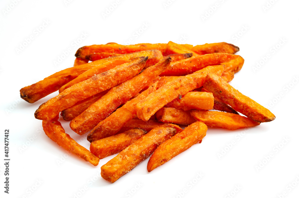 Healthy carbohydrates and carbohydrate and fiber rich foods vegetarian foods concept with picture of sweet potato fries isolated on white background with clipping path cutout